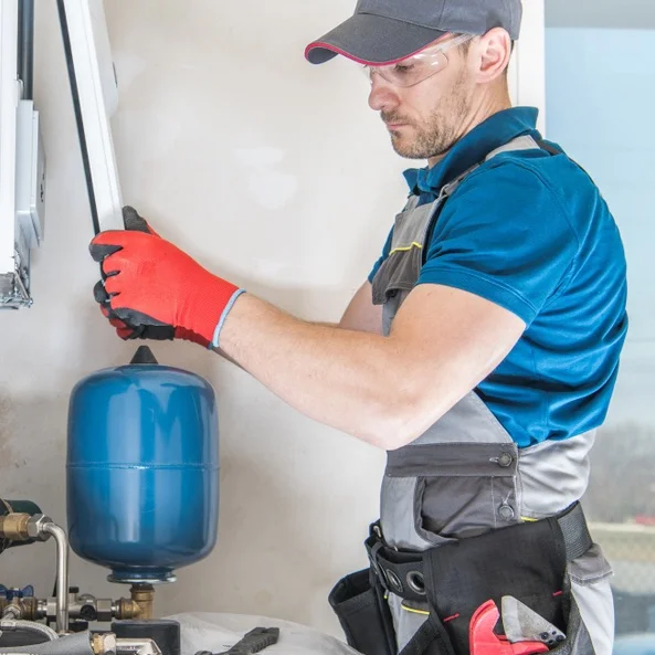 Central,Gas,Heater,Installing,By,Professional,Caucasian,Heating,Systems,Installer. image about us percy rauchs 1