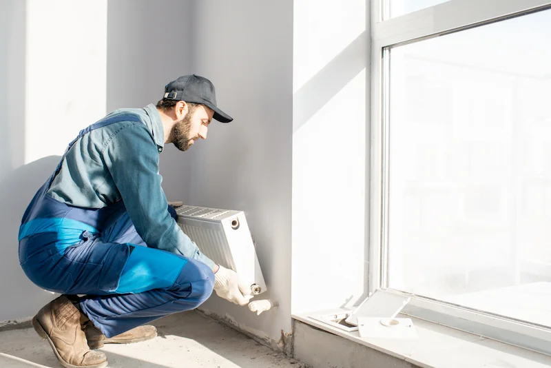 Workman,Mounting,Water,Heating,Radiator,Near,The,Window,In,The processus percy rauchs 1